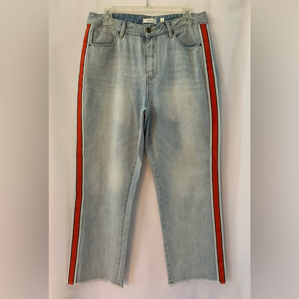 a loves a light blue Jean with red stripes on sides